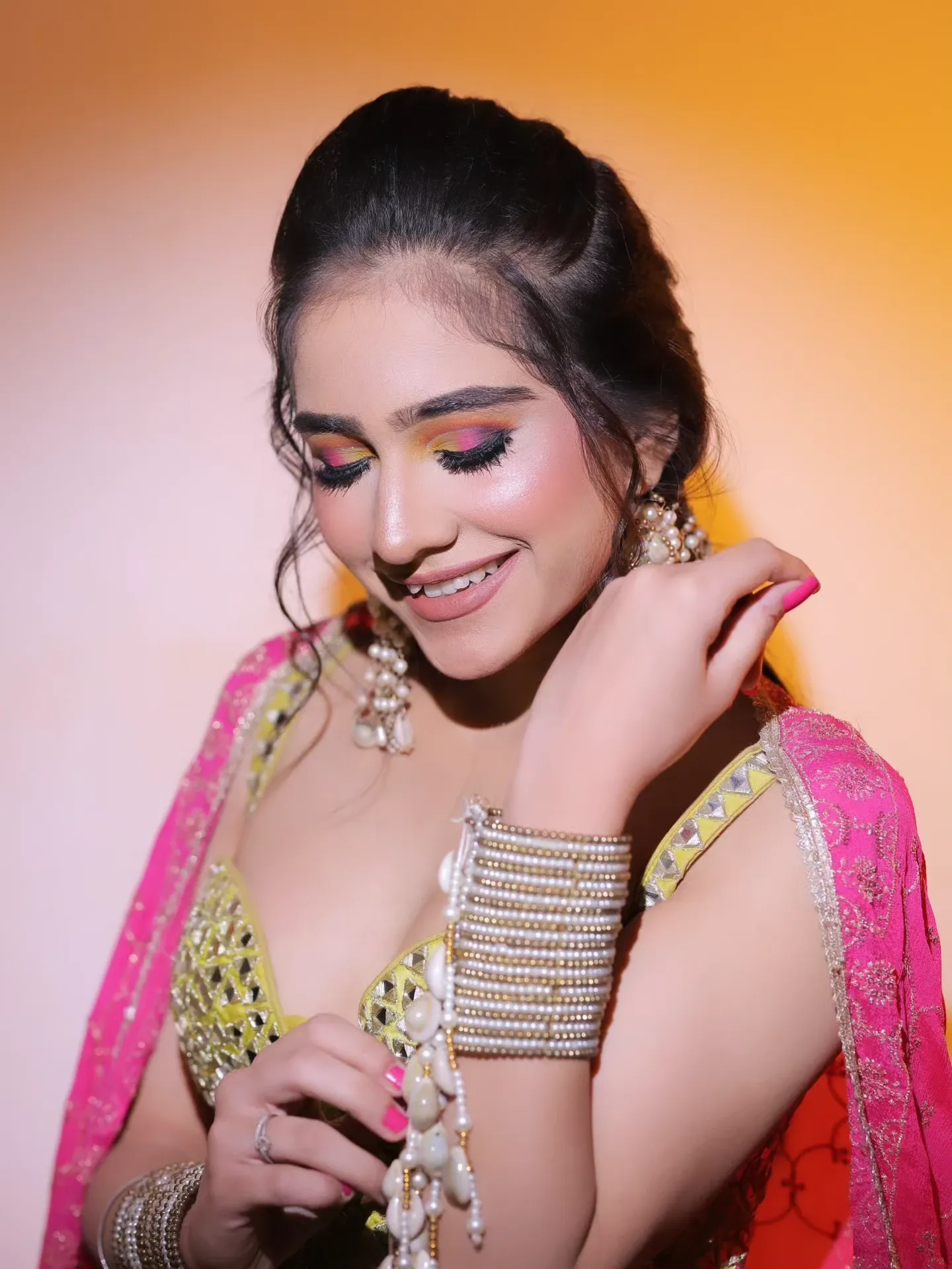 Colourful celebration makeup with glowing skin